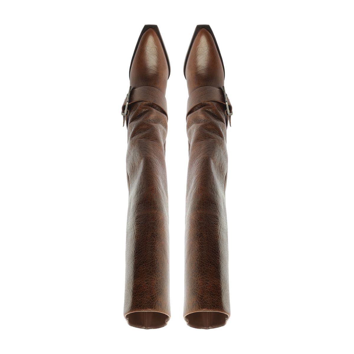 Front view of Parker Up Leather Boot in Desert Brown showcasing tall leather shafts and pointed toes against a white background