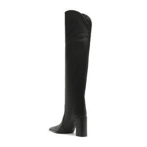 Side view of black over-the-knee leather boot showcasing pointed toe and block heel with white background