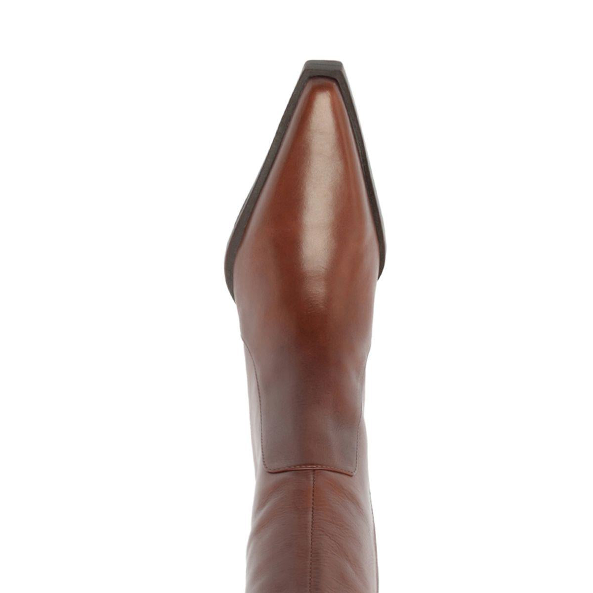 Close-up of the warm toffee Raffaela over-the-knee leather boot showcasing its pointed toe and tall shaft with a white background