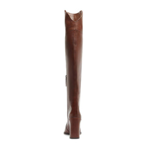 Rear view of Raffaela over the knee leather boot in warm toffee showcasing tall shaft and heel with white background