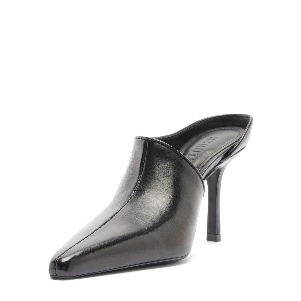 Side view of Abby leather pump in black showcasing pointed toe and slim stiletto heel on a white background