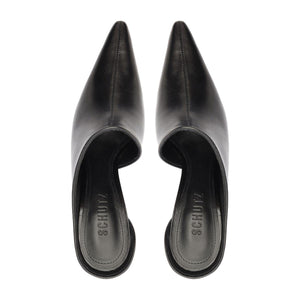 Top view of the Abby leather pumps in black showcasing pointed toes and open backs on a white background