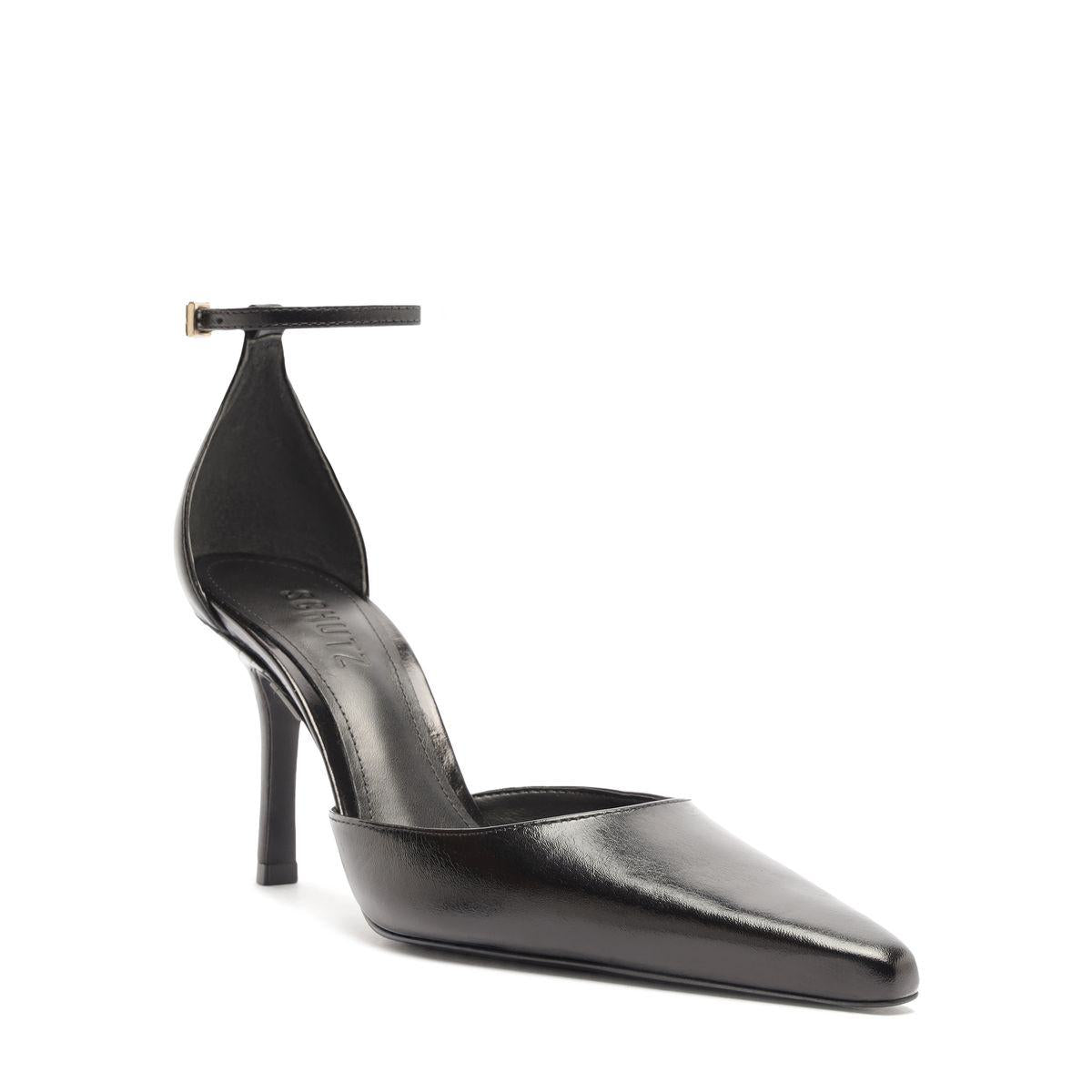 Side view of Jenny Leather Pump in Black showcasing pointed toe, buckle detail, and stiletto heel on a white background