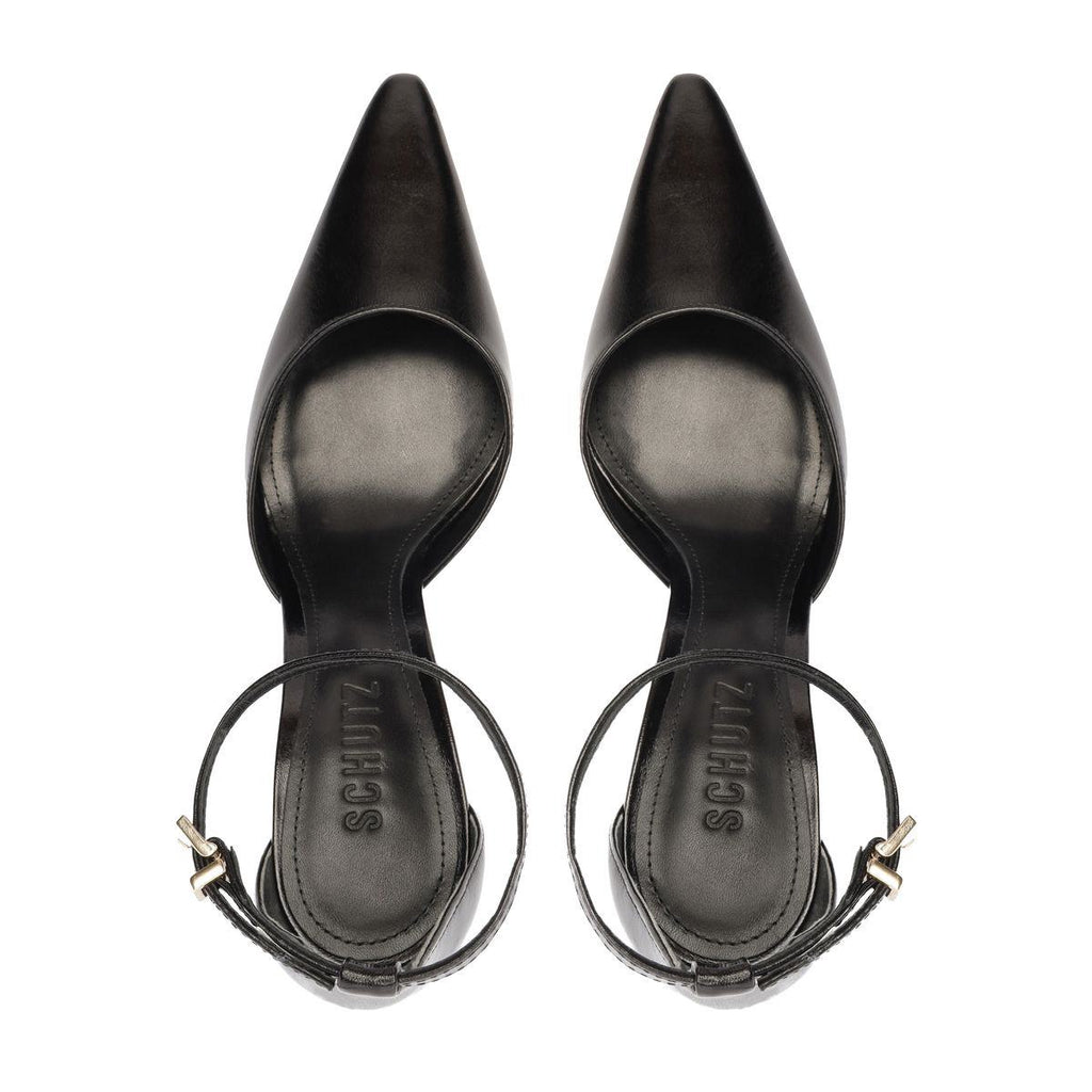 Top view of Schutz Jenny Leather Pump in Black showcasing pointed toes and ankle straps on a white background
