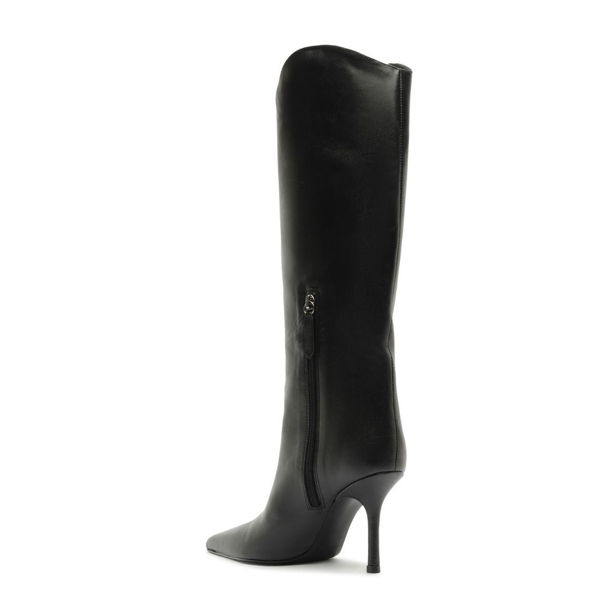 Side view of the Mary Ellen leather boot in black showcasing its tall shaft, pointed toe, and slim stiletto heel against a white background