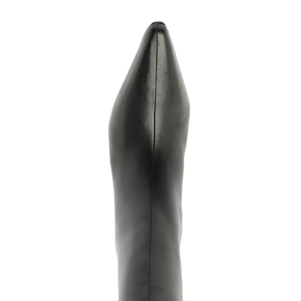 Close-up view of Mary Ellen leather boot in black showcasing smooth leather and a vertical seam against a white background