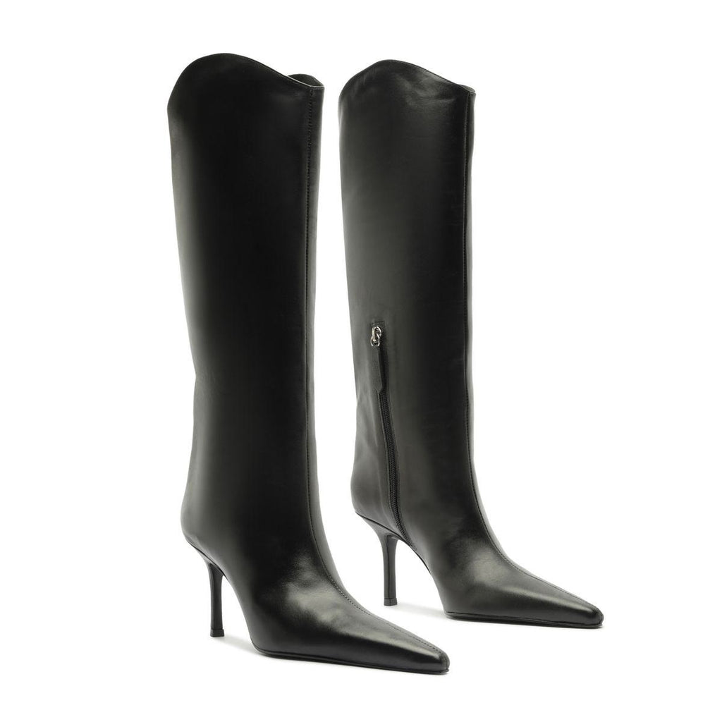Front view of Mary Ellen black leather boots showcasing pointed toes and slim high heels with a white background