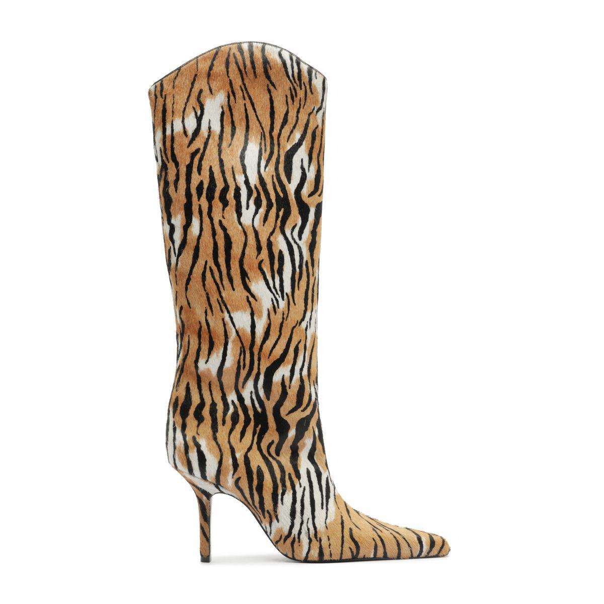 Side view of Mary Ellen Boot in Animal Print showcasing its tall shaft, pointed toe, and slim heel with a white background