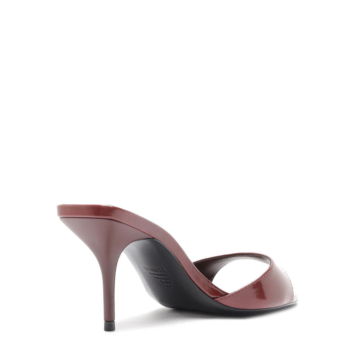 Side view of Elodie Leather Sandal in Wine Berry showcasing its leaf toe and stiletto heel on a white background