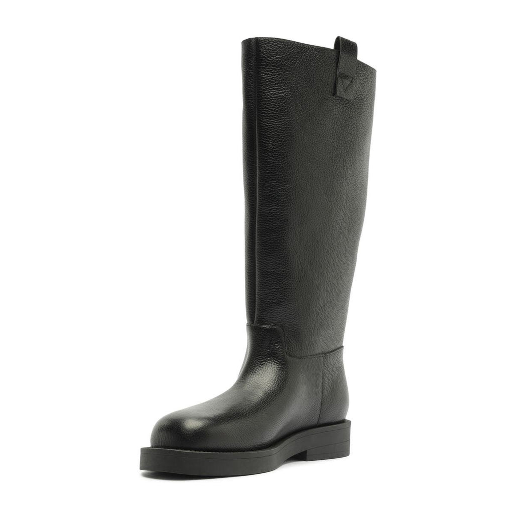 Side view of black Betty Boot showcasing knee-high shaft and block heel with white background