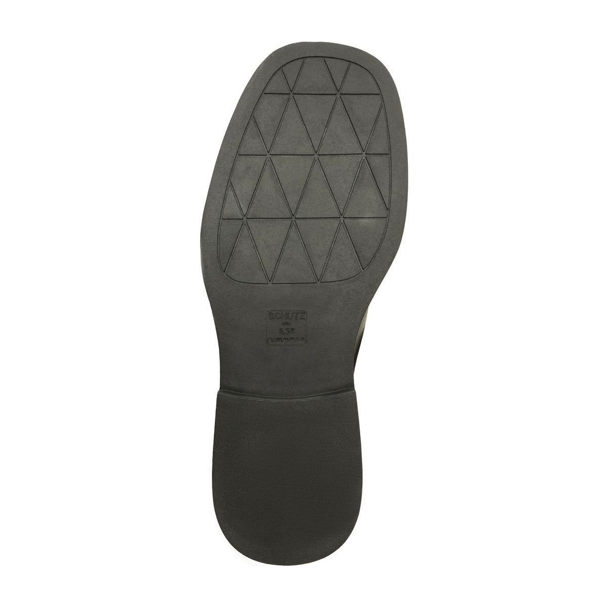 Bottom view of Betty Boot in Black showcasing geometric tread on the synthetic outsole against a white background