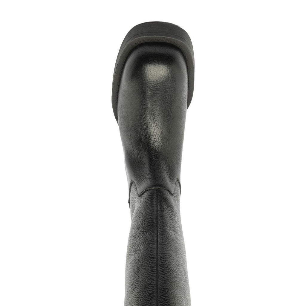 Close-up rear view of Betty Boot in Black showcasing its smooth leather shaft against a white background