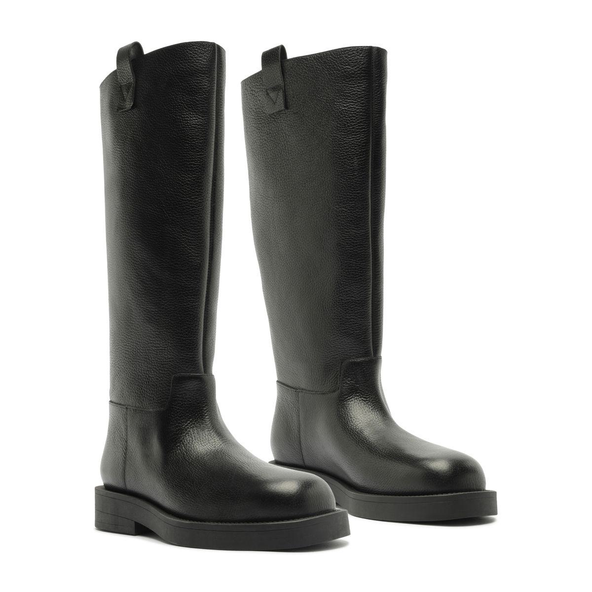 Front three-quarter view of Betty Boot in Black showcasing knee-high shafts and block heels with a white background