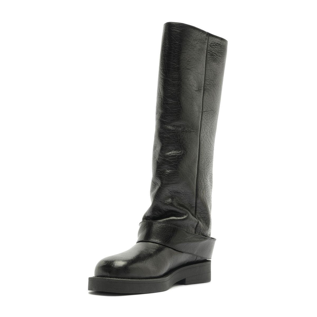 Angled side view of Patrice Up Boot in Black showcasing its tall shaft and chunky sole with a white background
