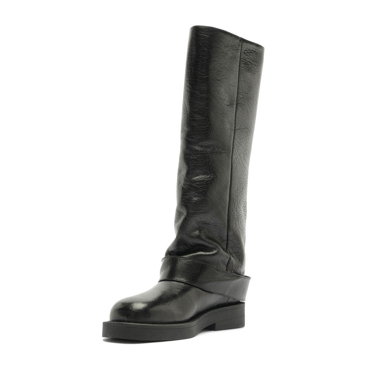 Angled side view of Patrice Up Boot in Black showcasing its tall shaft and chunky sole with a white background