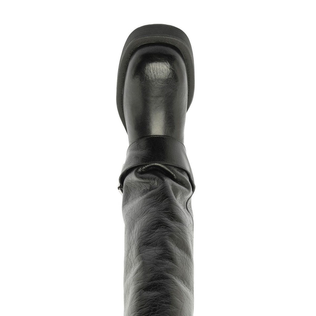 Close-up view of the black Patrice Up Boot showcasing its ruched shaft and rounded upper against a white background