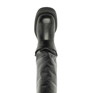 Close-up view of the black Patrice Up Boot showcasing its ruched shaft and rounded upper against a white background