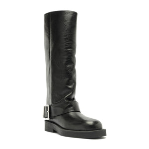 Three-quarter view of Patrice Up Boot in Black showcasing its tall ruched shaft, buckle strap, and lug sole on a white background