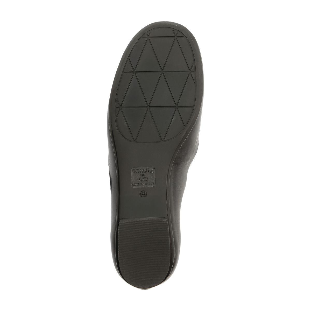 Bottom view of Molly Flat in Black showcasing geometric patterned synthetic outsole with white background