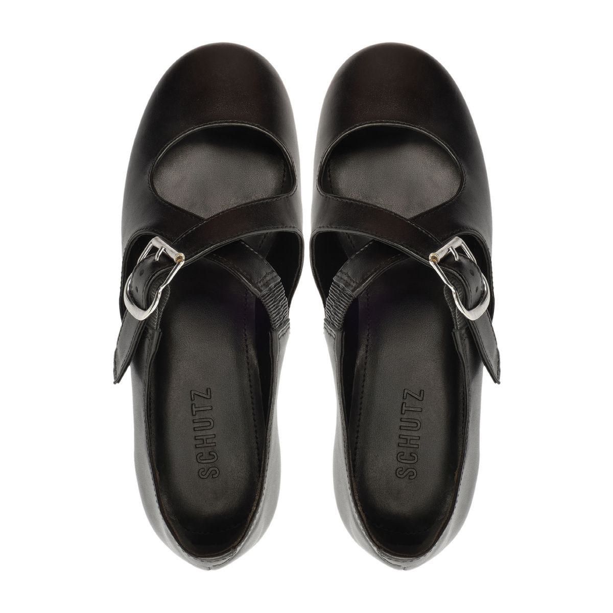Top view of Molly Flat in Black ballet flats showcasing rounded toes and buckle straps on a white background
