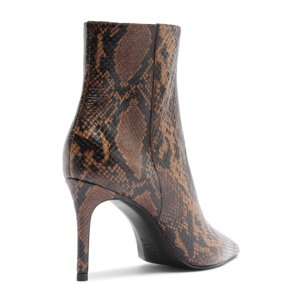 Side view of Mikki Bootie in Animal Print showcasing pointed toe, stiletto heel, and animal print upper on white
