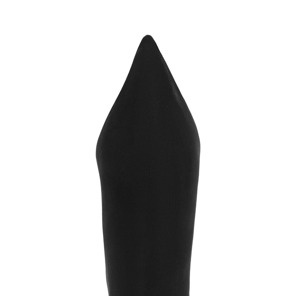 Close-up of Mikki Bootie in Black showcasing its sharp pointed toe with a white background