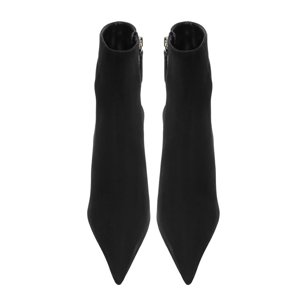 Front view of Mikki Bootie in Black showcasing pointed toes and sleek shafts against a white background