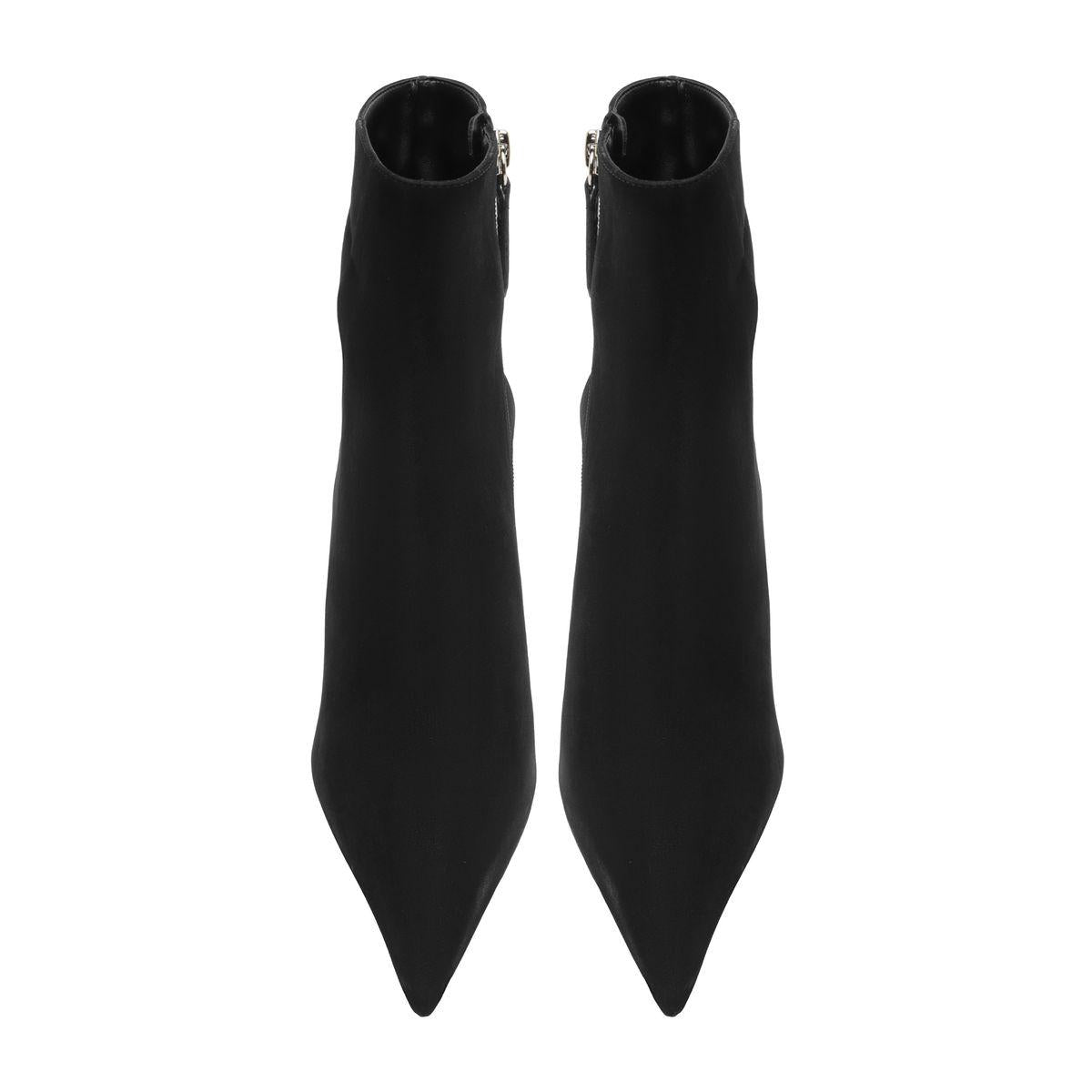 Front view of Mikki Bootie in Black showcasing pointed toes and sleek shafts against a white background