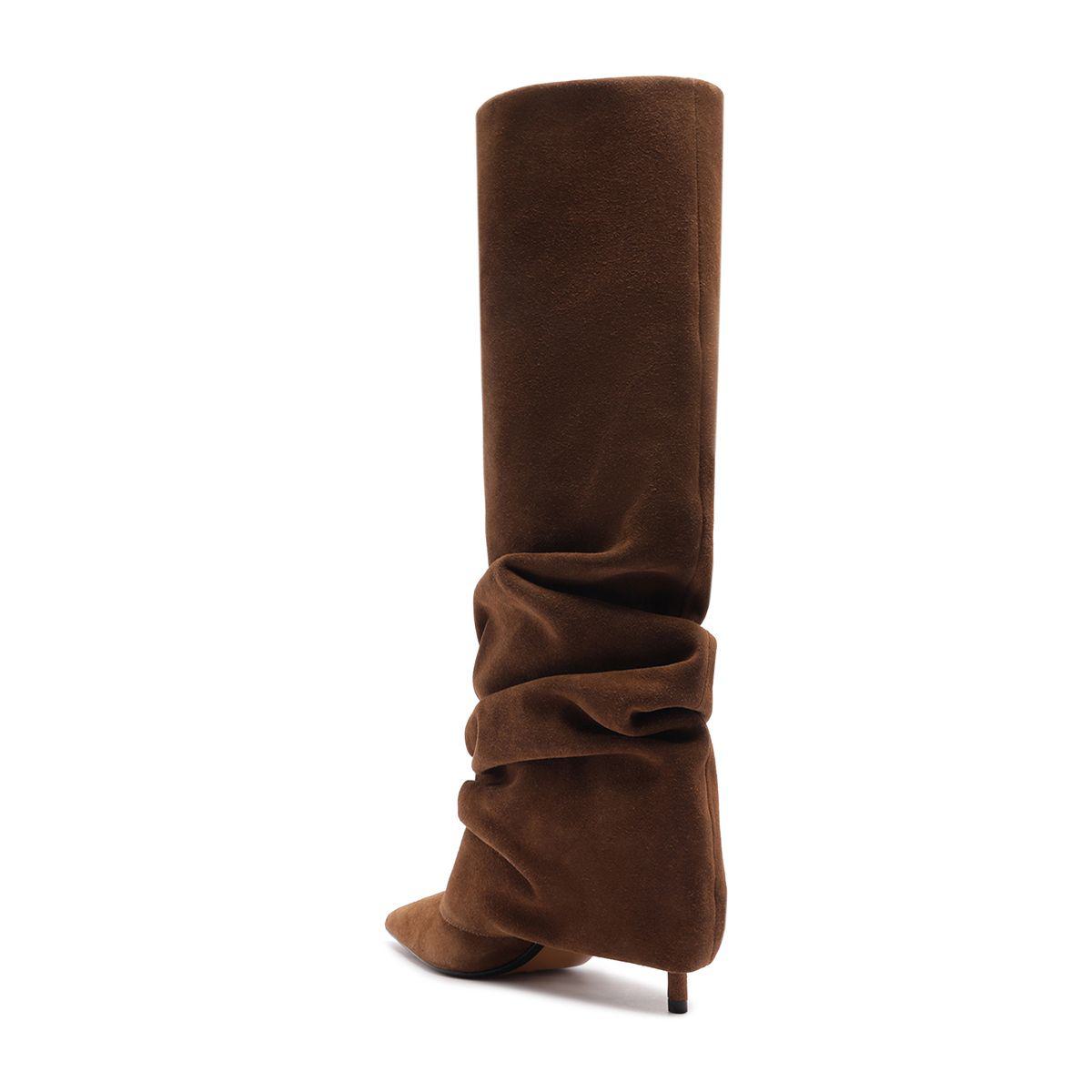 Side view of Mikki Up Cloak suede boot in pecan brown showcasing its slouchy tall shaft and pointed toe with white background