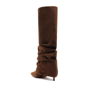 Side view of Mikki Up Cloak suede boot in pecan brown showcasing its slouchy tall shaft and pointed toe with white background