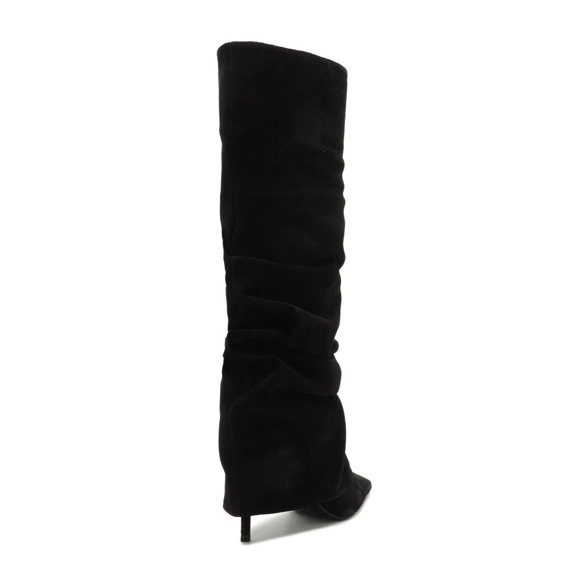 Side view of Mikki Up Cloak suede boot in black showcasing its tall slouchy shaft and slim heel with a white background