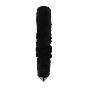 Front view of Mikki Up Cloak suede boot in black showcasing its tall ruched shaft and pointed toe with a white background