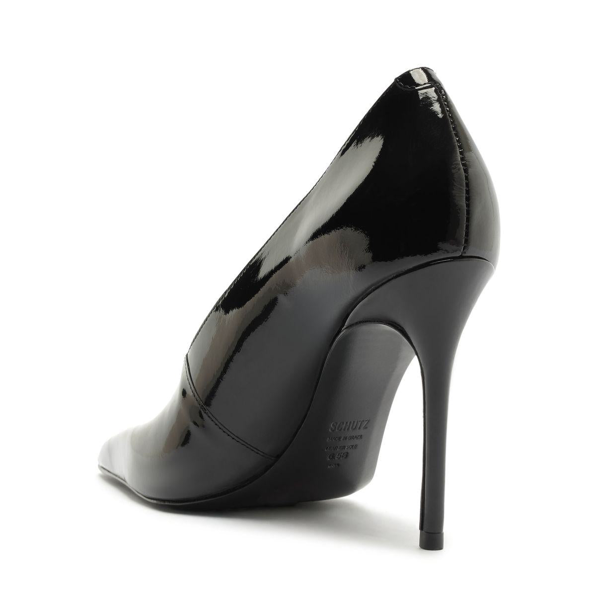 Side view of Claudia Patent Pump in Black showcasing its patent leather upper, pointed toe, and stiletto heel against a white background
