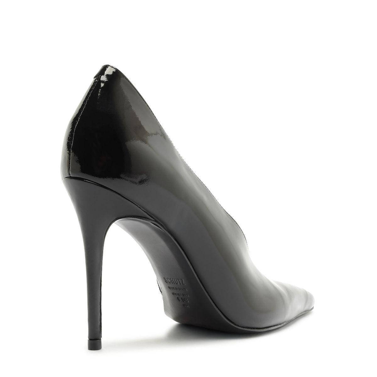 Side view of Claudia Patent Pump in Black showcasing its pointed toe and stiletto heel with a white background