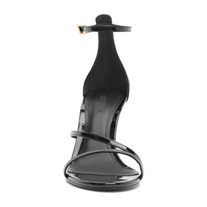 Front view of Tessa Patent Sandal in Black showcasing glossy straps, stiletto heel, and buckle closure on white background
