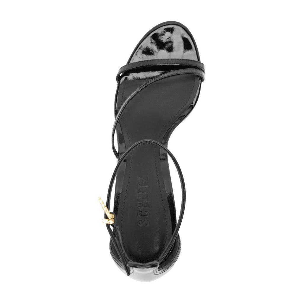 Top view of Tessa Patent Sandal in Black showcasing glossy patent straps and buckle on white background