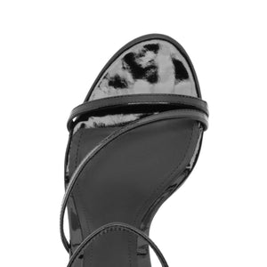 Top view of Tessa Patent Sandal in Black showcasing glossy patent straps with a white background