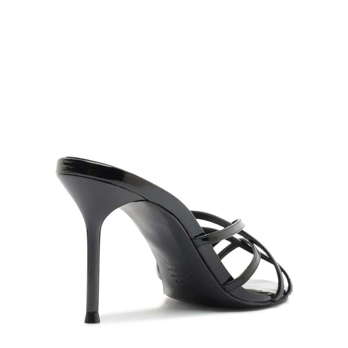 Side view of Marion Patent Sandal in Black showcasing delicate straps and high stiletto heel with a white background