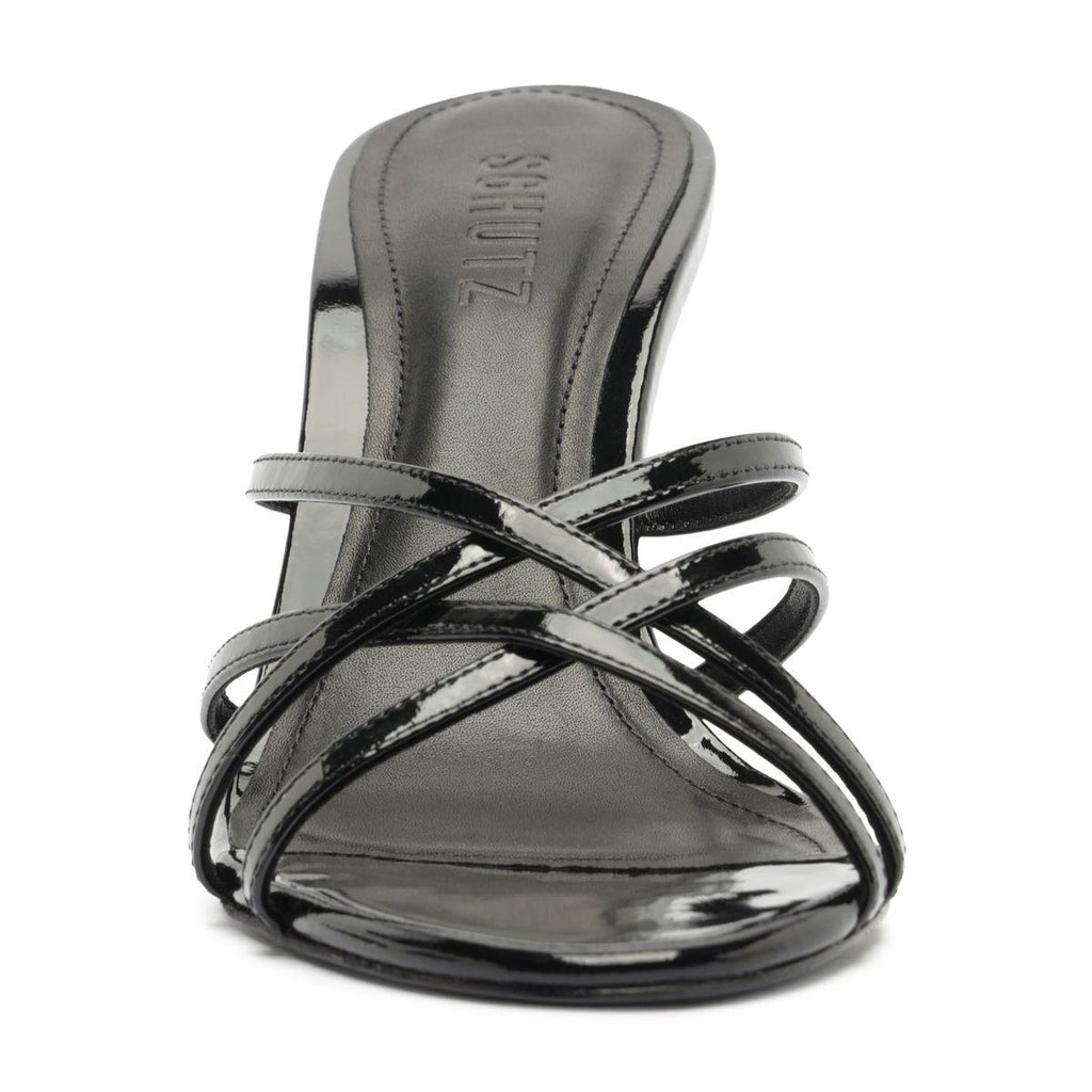Front view of Marion Patent Sandal in Black showcasing crossed patent leather straps and a stiletto heel with a white background