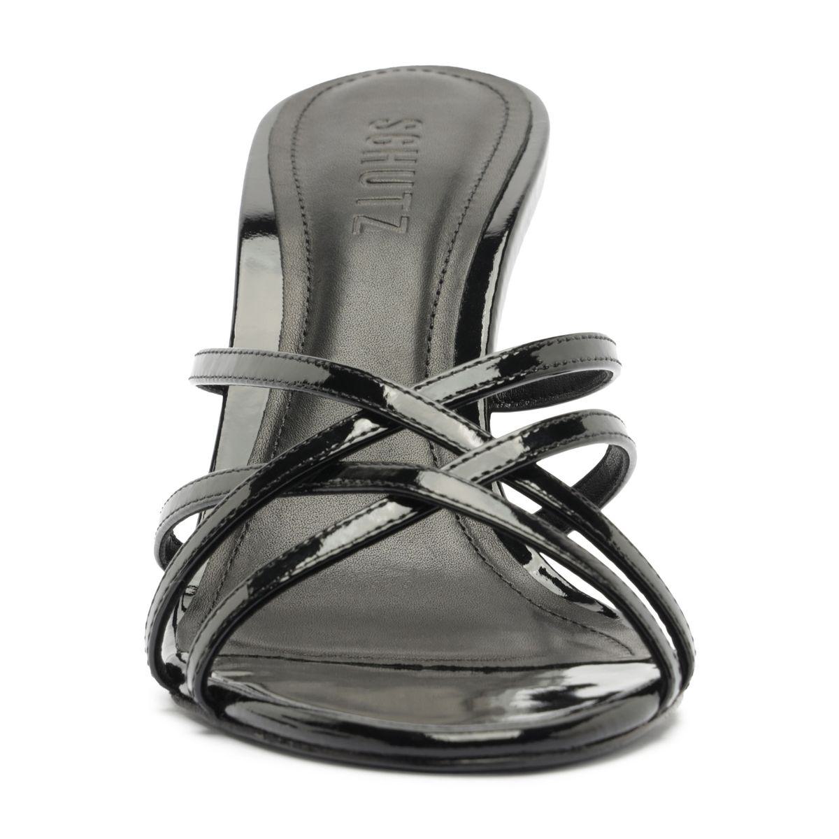 Front view of Marion Patent Sandal in Black showcasing crossed patent leather straps and a stiletto heel with a white background