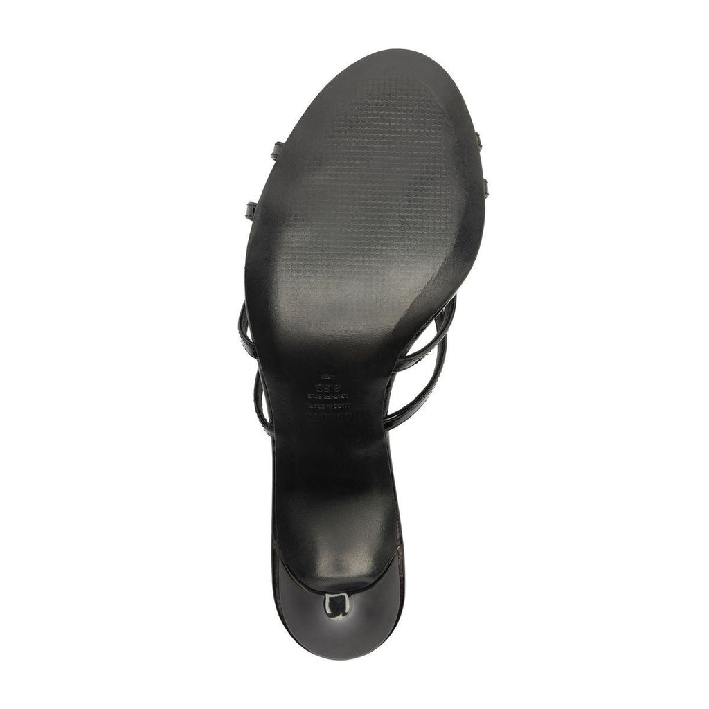 Bottom view of Marion Patent Sandal showcasing black leather outsole and stiletto heel on a white background