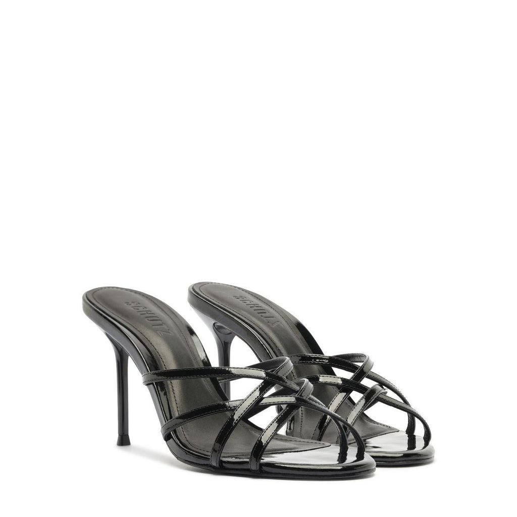 Front three-quarter view of Marion Patent Sandal in Black showcasing delicate patent leather straps and stiletto heel with white background