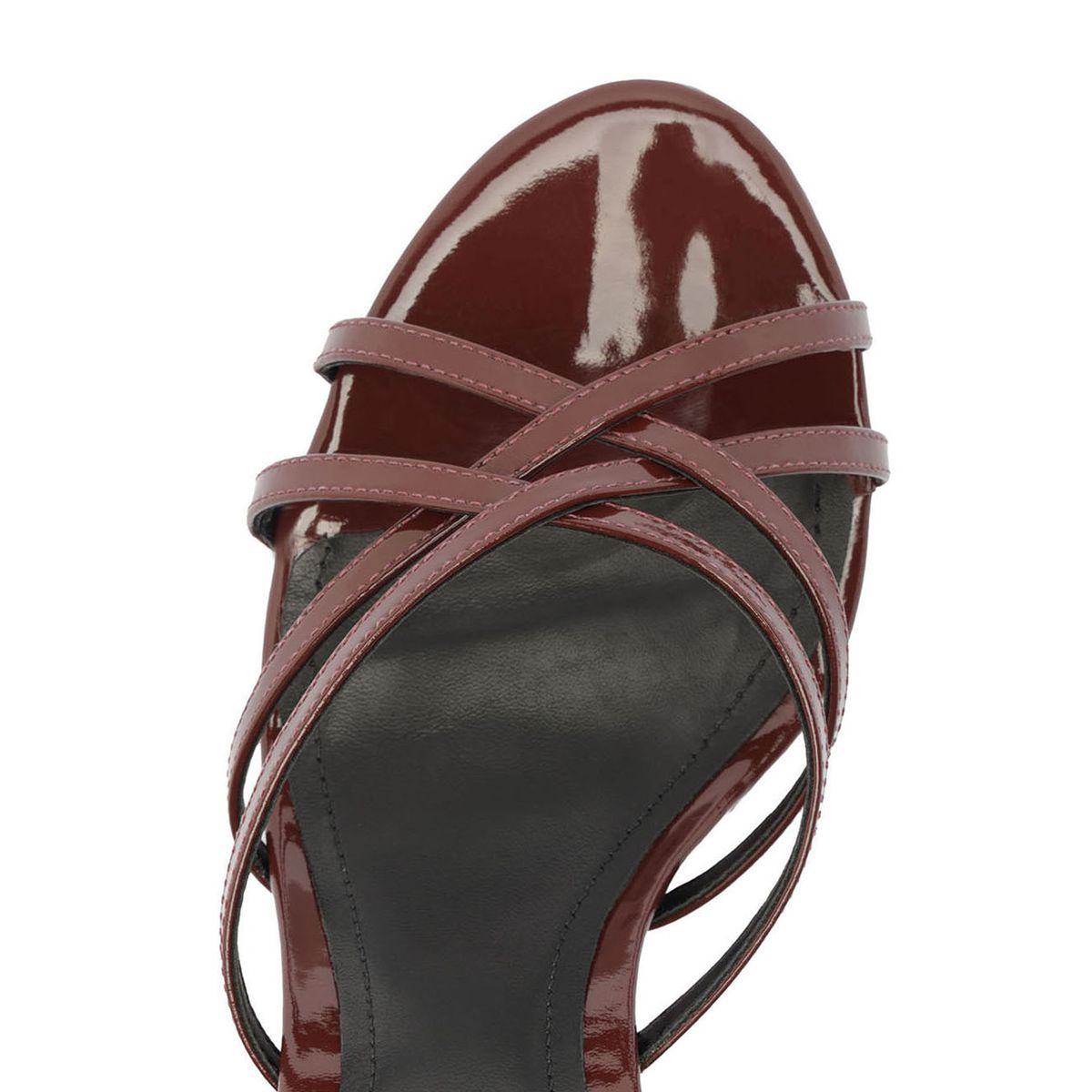 Top view of Marion patent sandal in Port Burgundy showcasing crisscross straps and glossy finish with white background