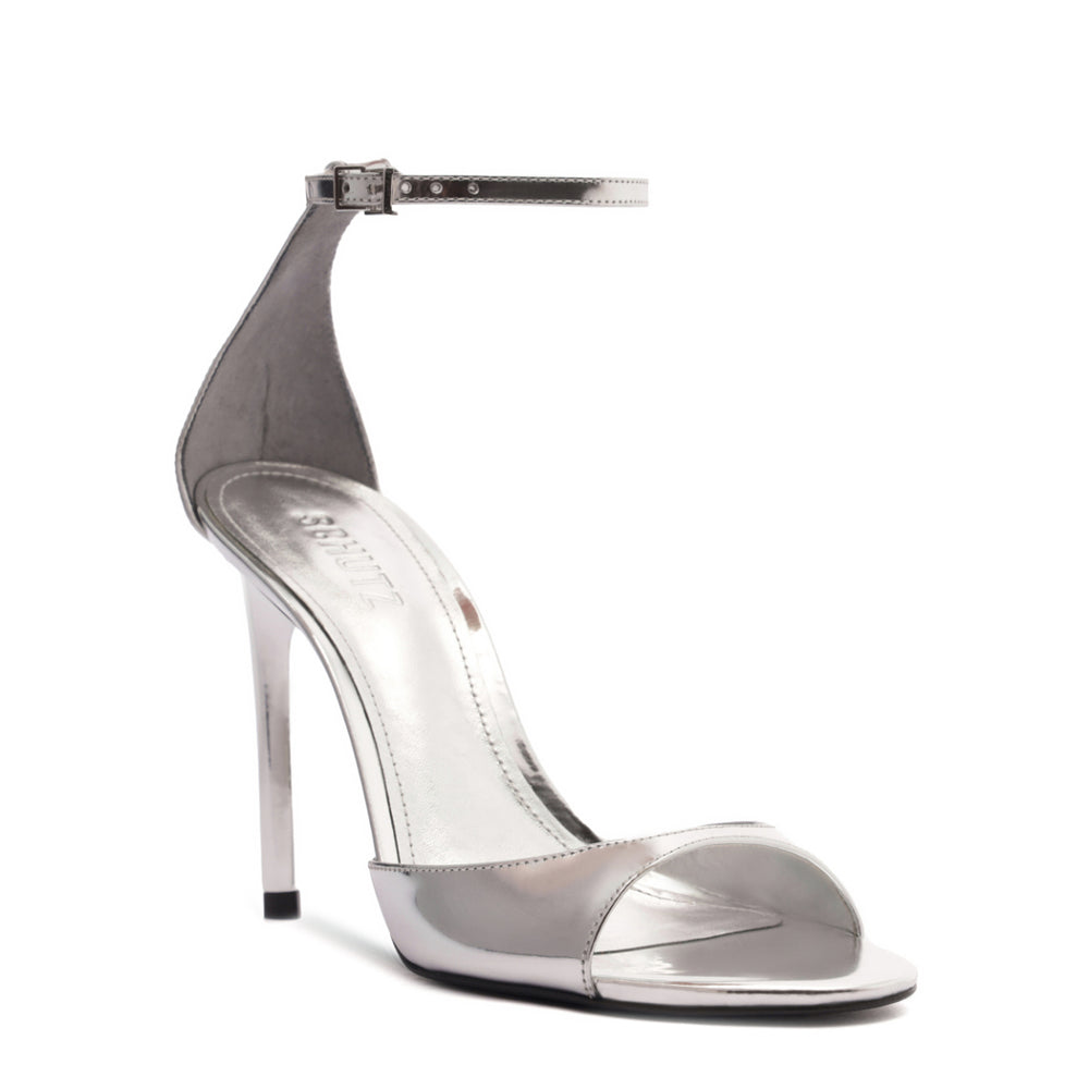 Angled view of Scarlett metallic sandal in Prata with open toe, thin ankle strap and high stiletto heel on white background