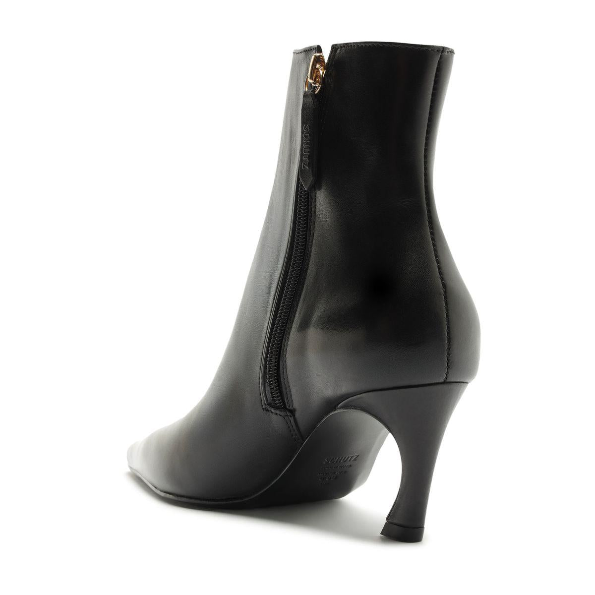 Side view of Lexi Leather Bootie in Black showcasing pointed toe, sculptural heel, and zip closure against a white background