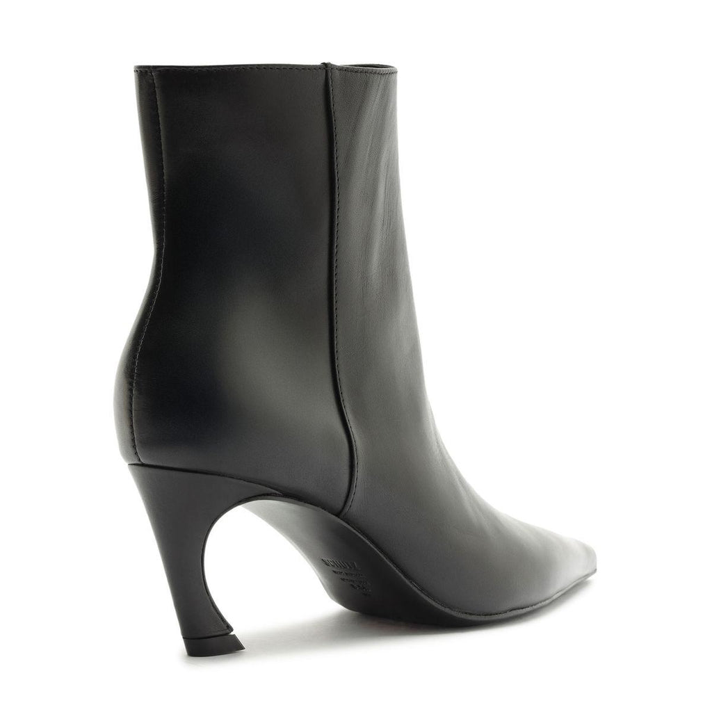 Side view of Lexi Leather Bootie in Black showcasing sculptural heel and pointed toe against a white background