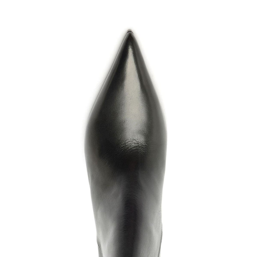 Close-up view of Lexi Leather Bootie in black showcasing its sharply pointed leather toe against a white background
