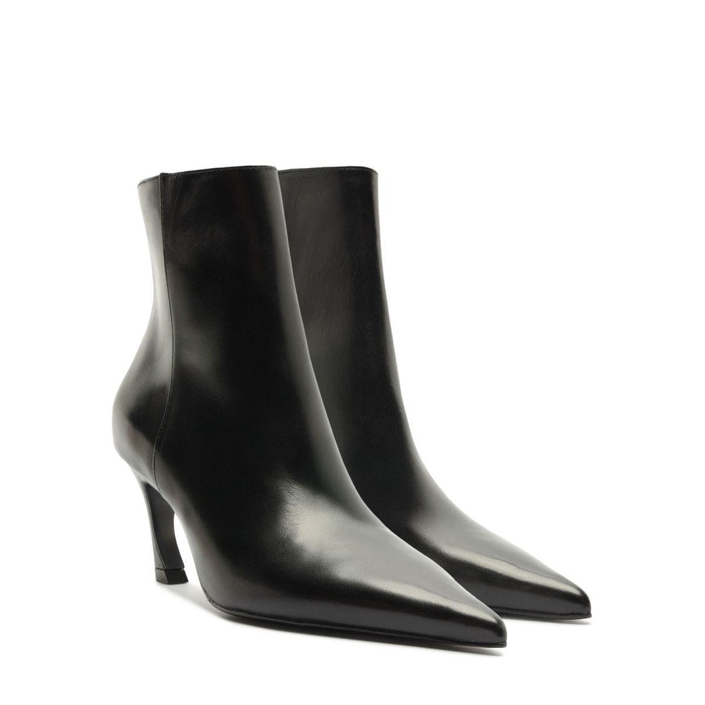 Angled view of Lexi Leather Bootie in Black showcasing pointed toes and sculptural heels on a white background