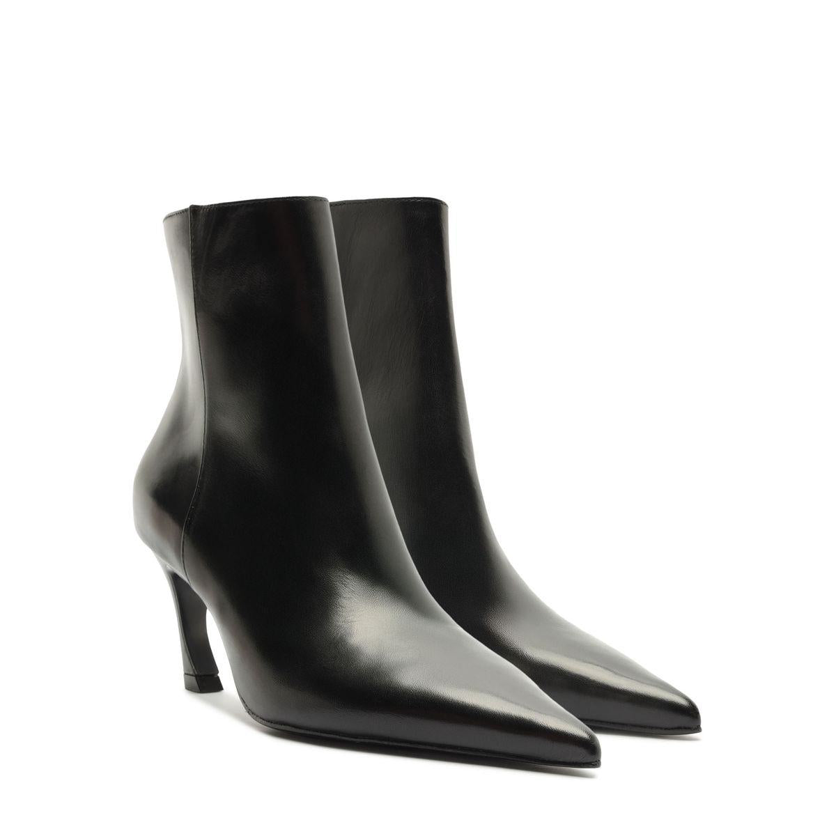Angled view of Lexi Leather Bootie in Black showcasing pointed toes and sculptural heels on a white background