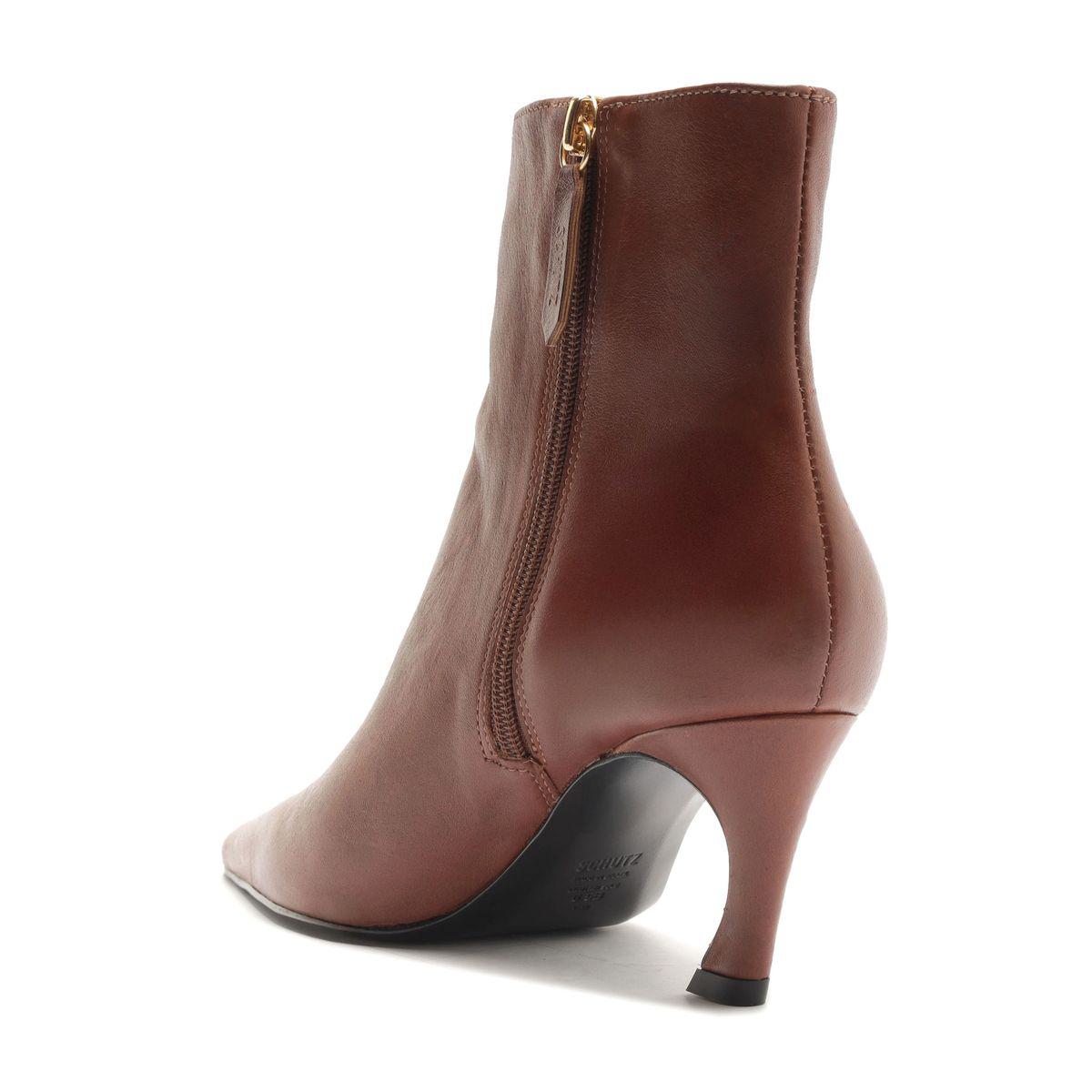 Side view of Lexi Leather Bootie in Warm Toffee showcasing its curved high heel and side zipper against a white background